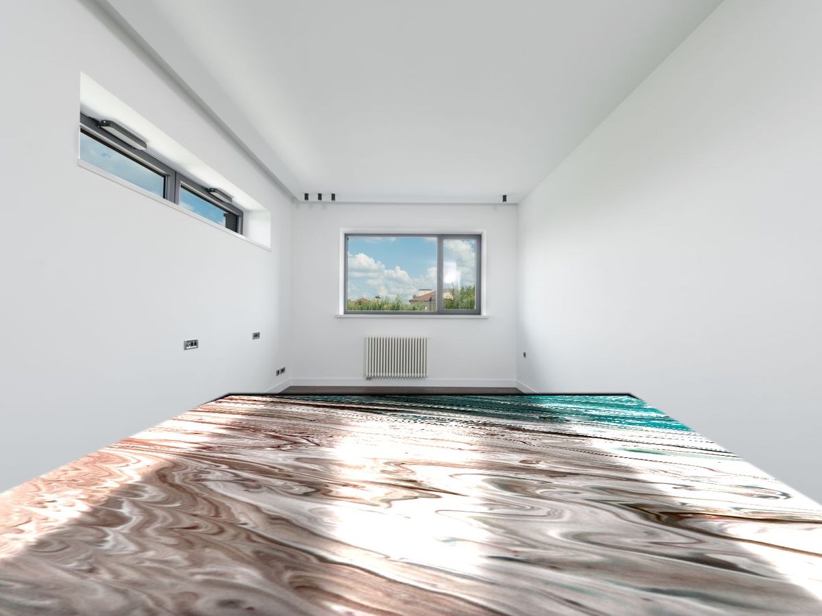 Metallic marble epoxy floor in warm earth tones flowing through a sunlit space