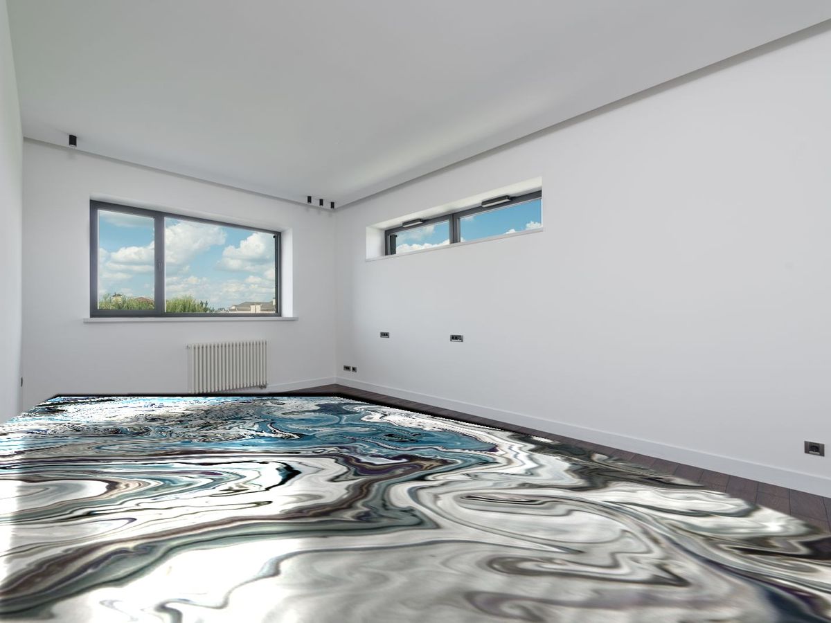Metallic marble epoxy floor in navy, silver and white poured across a bright room