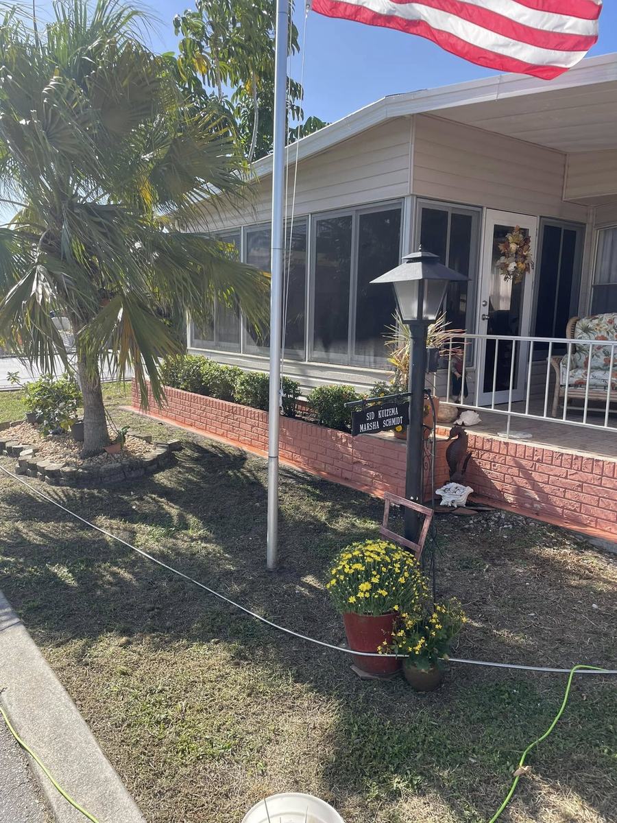 Exterior project 3, before &mdash; front porch and red brick planter